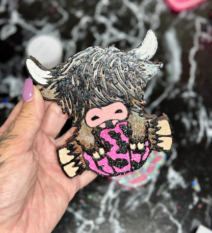 Highland Cow Holding a Pumpkin